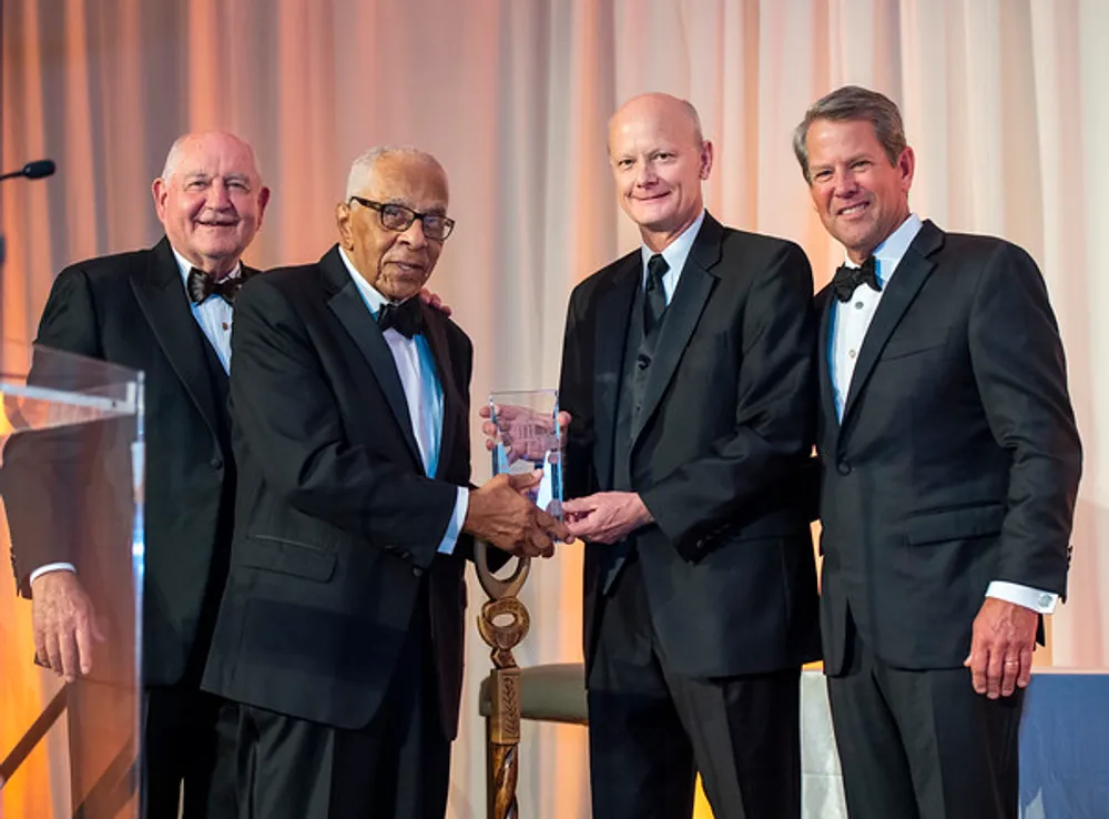 From left, USG Chancellor Sonny Perdue, Regent Emeritus Elridge McMillan, former USG Chancellor Steve Wrigley and Governor Brian P. Kemp. McMillan presented Wrigley with the Elridge McMillan Lifetime Achievement Award at the USG Foundation Gala on Sept. 9.