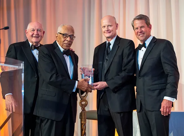 From left, USG Chancellor Sonny Perdue, Regent Emeritus Elridge McMillan, former USG Chancellor Steve Wrigley and Governor Brian P. Kemp. McMillan presented Wrigley with the Elridge McMillan Lifetime Achievement Award at the USG Foundation Gala on Sept. 9.