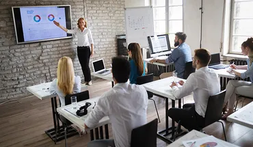 a classroom of students watching an instructor